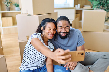 Portrait of a young couple unpacking, moving in and relocation to a new apartment, happy young...