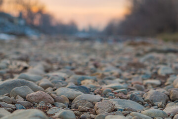 Close up natural landscape from a lower angle with a multifaceted view of a dried-up river, at the bottom of which there is no water. Blank for artwork with copy space, natural environment