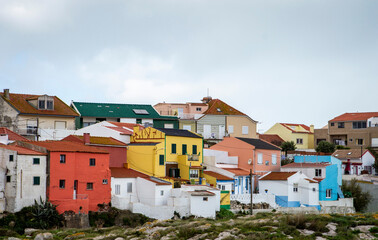 Scenic overview of colorful Portuguese village houses in Peniche, Portugal.