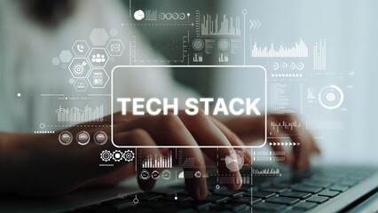 Hands Typing on Laptop Keyboard with Tech Stack Visuals and Data Graphics in Modern Workspace....