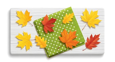 Autumn arrangement featuring colorful leaves and a polka dot napkin on a wooden surface