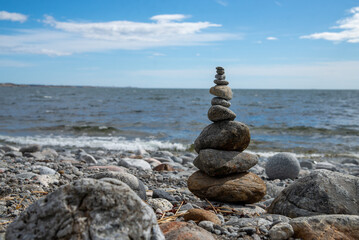 Balanced Rock Stack by the Sea under Blue Sky