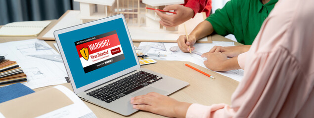 Virus warning alert on computer screen detected brisk cyber threat , hacker, computer virus and...