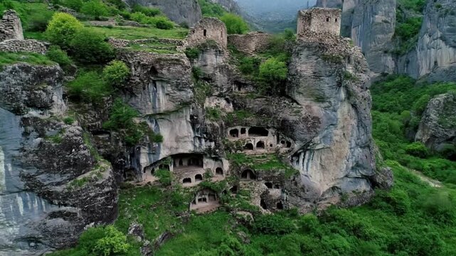 Ancient cave architecture carved into a rocky mountain cliff offers a glimpse into the history and cultural heritage of vardzia, georgia