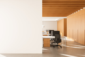 Modern office interior with blank wall space and wooden design elements in clean daylight setting....
