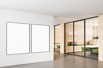 Blank framed posters mockup on white wall in modern office interior with glass partitions and wooden furniture, clean design concept template layout. 3D Rendering
