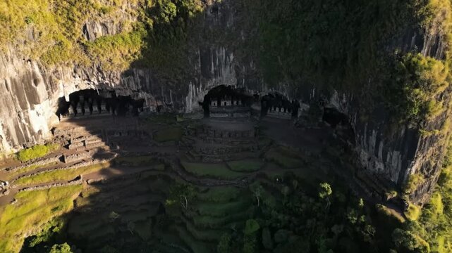 The gedong songo temple in java, indonesia, perched atop a mountain, offering a breathtaking view of the surrounding landscape and volcanic peaks