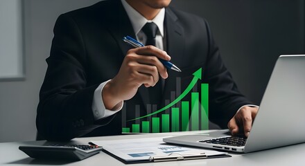 Businessman analyzing financial data with laptop, showing market growth and success.