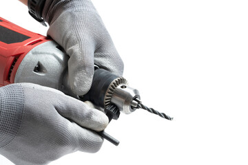 Closeup an electric drill in hands worker in gray gloves on white background.