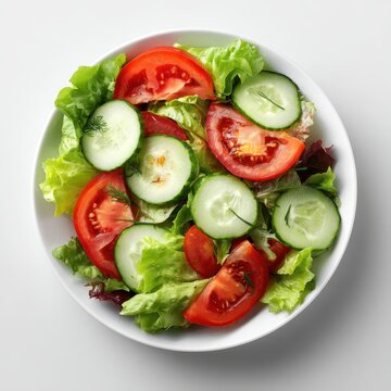 A white bowl filled with a salad of cus, tomatoes, cus, cus, cus