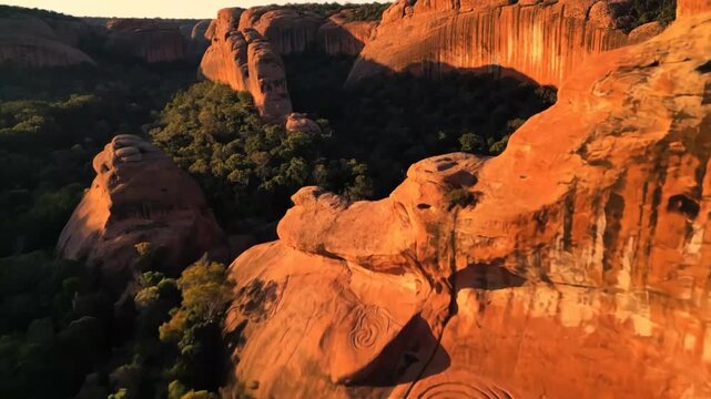 Ancient Aboriginal Art on Red Rock Cliffs Spirals tell stories of Dreamtime wisdom in Central Australia with drone