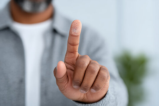 Person Using Fingerprint Scanner for Security and Identity Verification Technology