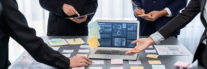 Analyst team use sticky note for creative and analytic brainstorm for business idea with BI data...