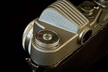 Old camera on a dark background close up. Shallow depth of field