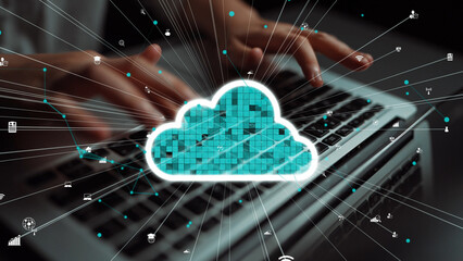 A conceptual representation of cloud computing featuring hands typing on a laptop, with data...