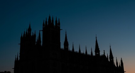 Gothic Architecture Silhouette at Dusk - A majestic silhouette of gothic architecture against a twilight sky. Dark, mysterious, and evocative of history