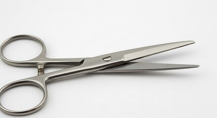 Obraz premium A detailed close-up photograph of a pair of stainless steel surgical scissors, isolated on a clean white background.