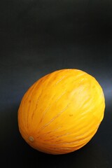 yellow melon, cantalupe melon, fruit on black background, juicy fruit
