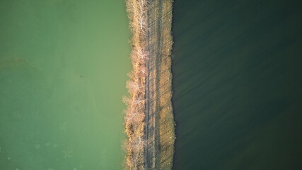 Dividing Road Between Two Colored Lakes