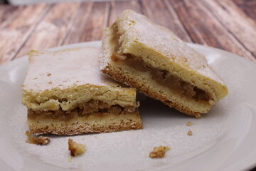 apple pie on a plate, on a wooden table