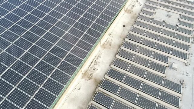 Aerial view of solar panels on a rooftop generating renewable energy
