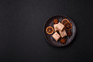 Nougat or white caramel with hazelnuts and pistachios and citrus pieces. White nougat with nuts