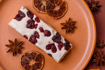 Nougat or white caramel with hazelnuts and pistachios and citrus pieces. White nougat with nuts