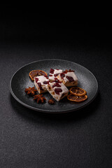 Nougat or white caramel with hazelnuts and pistachios and citrus pieces. White nougat with nuts