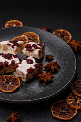 Nougat or white caramel with hazelnuts and pistachios and citrus pieces. White nougat with nuts