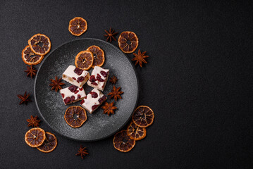 Nougat or white caramel with hazelnuts and pistachios and citrus pieces. White nougat with nuts