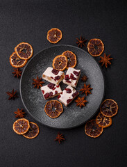 Nougat or white caramel with hazelnuts and pistachios and citrus pieces. White nougat with nuts