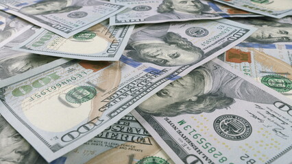 A CloseUp View of Various Different U.S. Dollar Bills Beautifully Laid Out on a Table Surface
