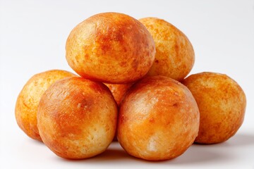 Fufu dough balls arranged on a clean white background showcasing the traditional texture and golden color of this popular West African dish made from cassava and plantains