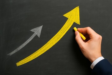 Hand sketching yellow chalk arrow showing progress, with faded white arrow in background