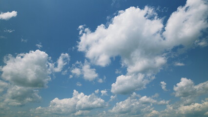 Time lapse. A Beautiful, Softly Cloudy Sky Gracefully Spreads Over the Expansive and Vibrant Blue...