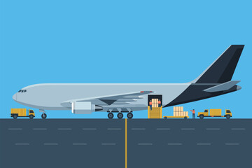 Cargo plane being loaded with boxes by workers at the airport on a sunny day with trucks present