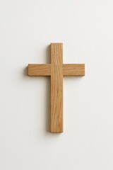 Simple wooden cross on clean white background for religious design