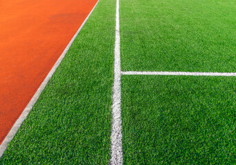 Football green field with white line and running rubber track texture with . Sport background concept.