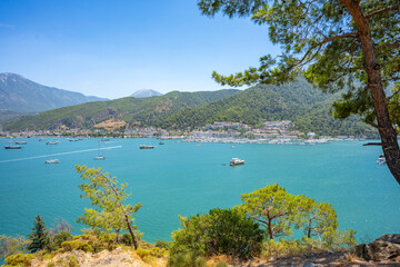 Obraz premium Boncuk Bay, Blue Lagoon and Oludeniz beach aerial panoramic view. Oludeniz is a beach resort in the Fethiye district of Mugla Province, Turkey.