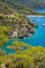 Naklejka premium Boncuk Bay, Blue Lagoon and Oludeniz beach aerial panoramic view. Oludeniz is a beach resort in the Fethiye district of Mugla Province, Turkey.