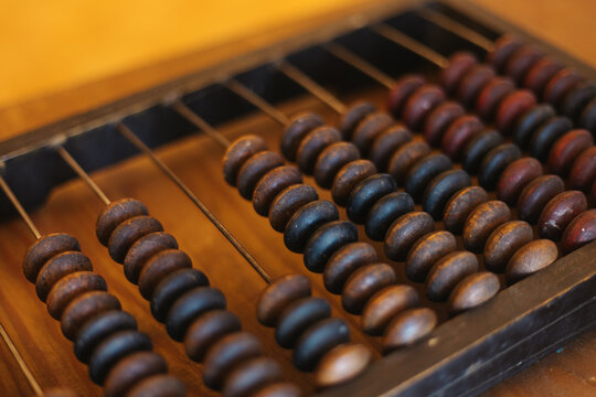 old wooden abacus on wooden table