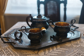 cup of coffee and teapot