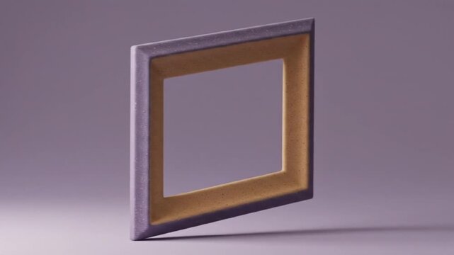 A square frame with a gold inner border and a gray outer border stands on a gray surface angled sideways