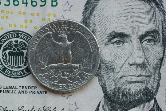 American cent coin on dollar bill close up. United States currency