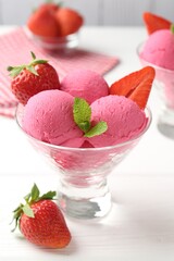 Refreshing sorbet, strawberries and mint in dessert bowl on white wooden table, closeup