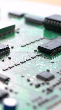 Circuit board holds cpu, chip and transistor on green background. Repair of digital device ensures stable pc performance. Semiconductor links science and technology in computer system