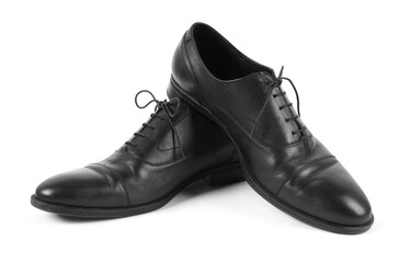 Pair of black leather shoes on white background