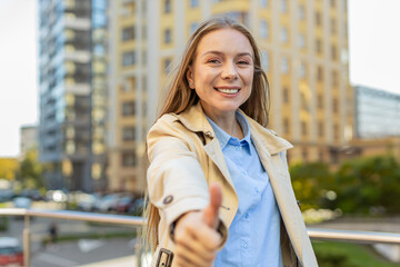 Like. Happy mature woman raises thumb up agrees with something or gives positive reply recommends...