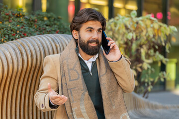 Phone call, good news, gossip. Happy amazed surprised Indian young businessman tourist in pleasant...