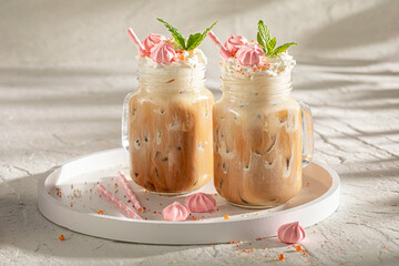 Tasty and sweet ice coffee with sprinkles and whipped cream.